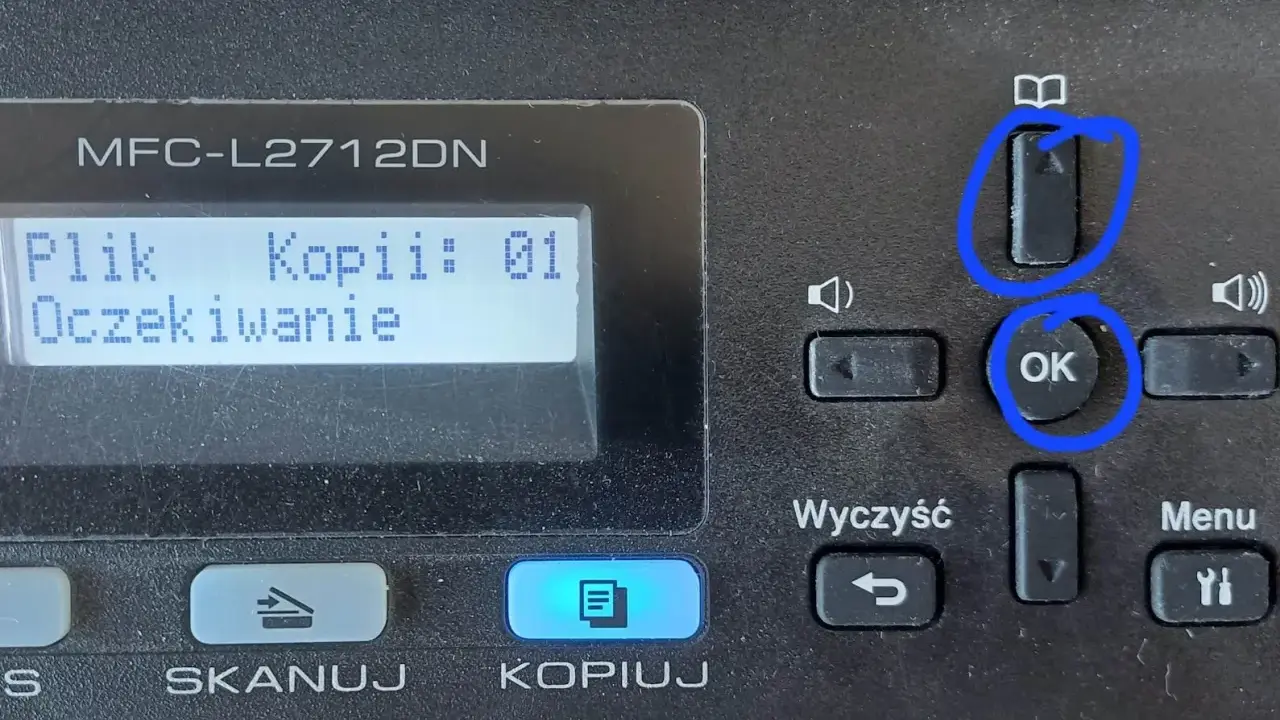 Drukarka Brother MFC-L2712DN. Ekran pokazuje "Plik Kopii: 01 Oczekiwanie". Przyciski "OK" i "Reset bębna" (ikona książki) są zaznaczone.