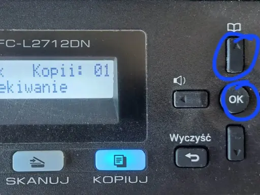 Drukarka Brother MFC-L2712DN. Ekran pokazuje "Plik Kopii: 01 Oczekiwanie". Przyciski "OK" i "Reset bębna" (ikona książki) są zaznaczone.
