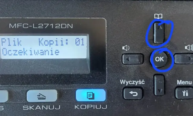 Drukarka Brother MFC-L2712DN. Ekran pokazuje "Plik Kopii: 01 Oczekiwanie". Przyciski "OK" i "Reset bębna" (ikona książki) są zaznaczone.